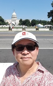 Luke Chung in front of the Captial Building